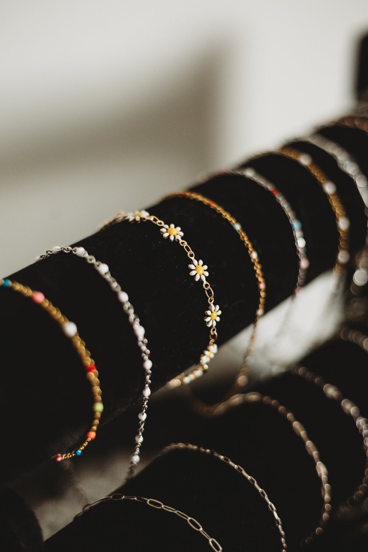 Close-up of permanent jewelry chains displayed at Beauty Lodge